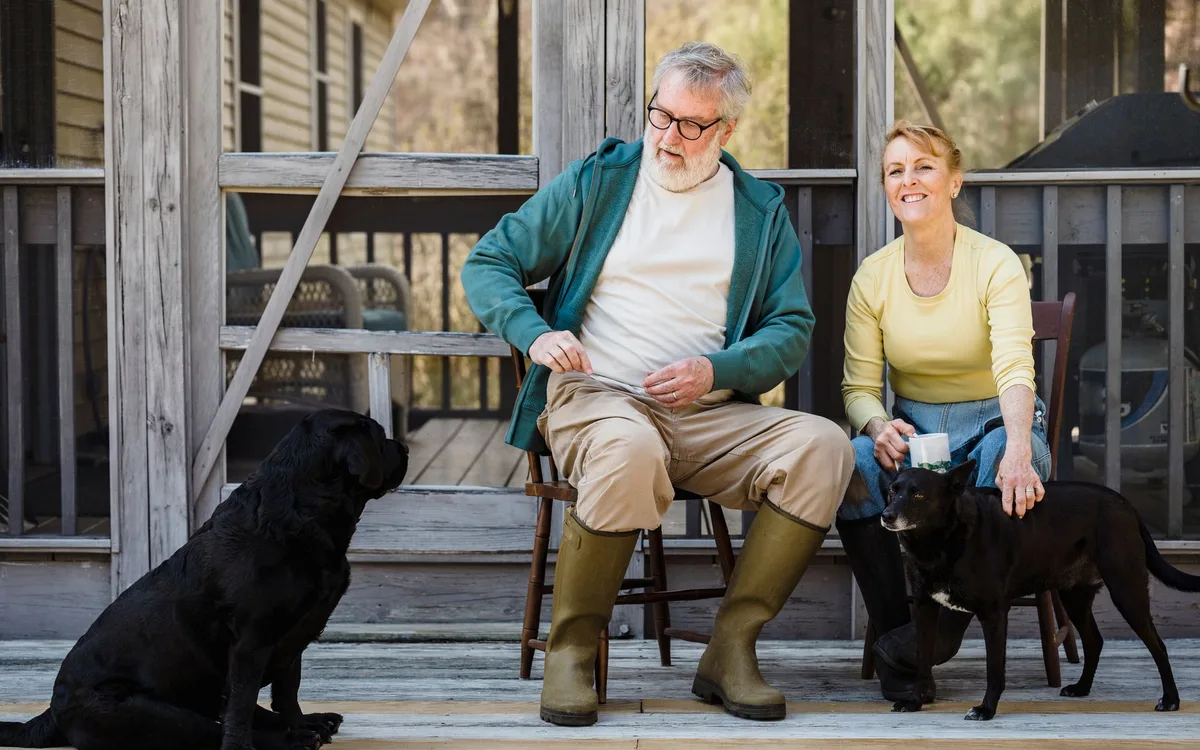 A couple enjoying coffee on their porch